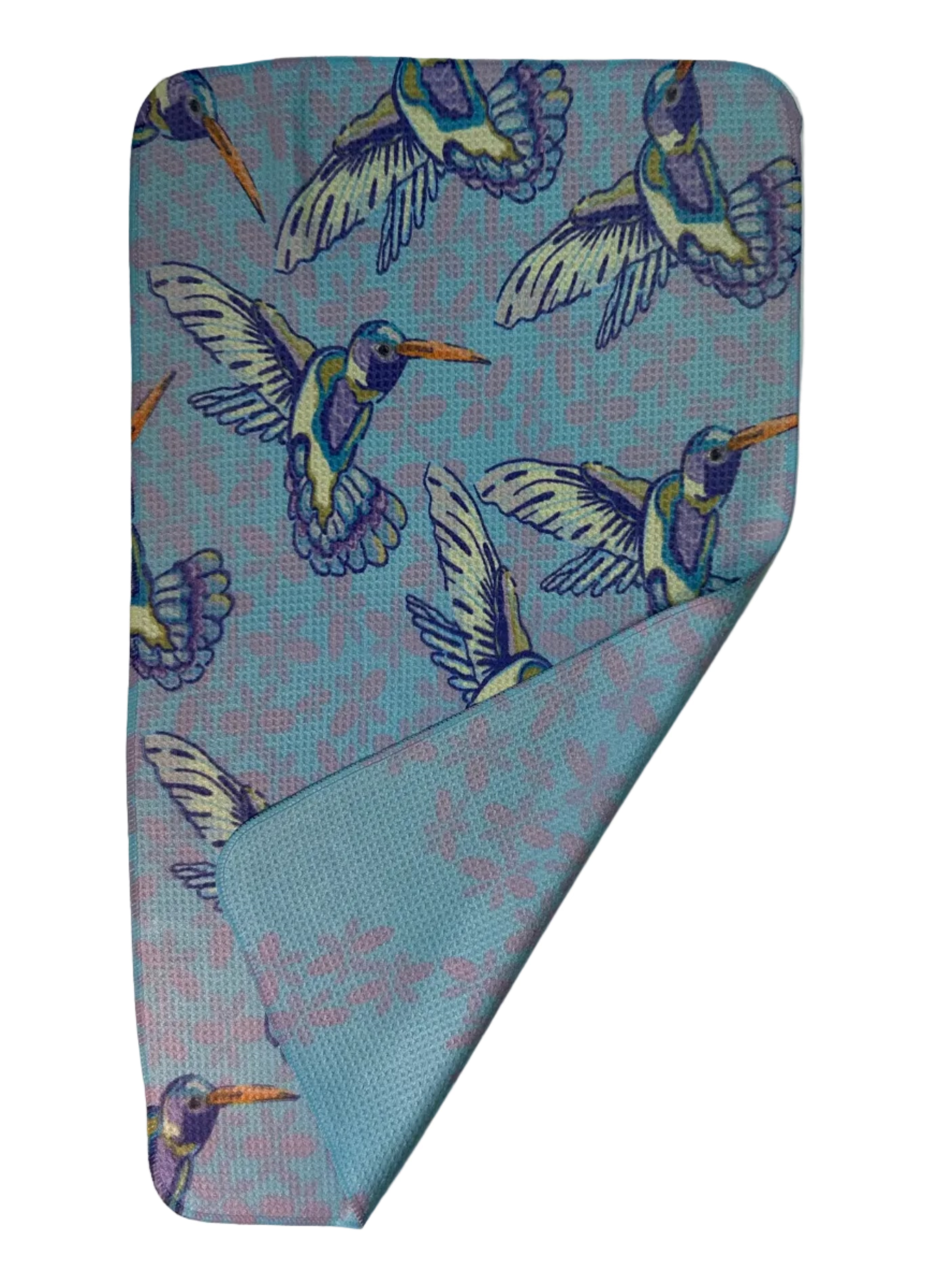 Folded towel with hummingbird pattern on a white background