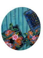 Decorative round plate with floral design on a white surface