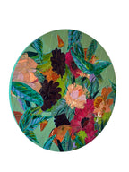 Round floral artwork on a white wall