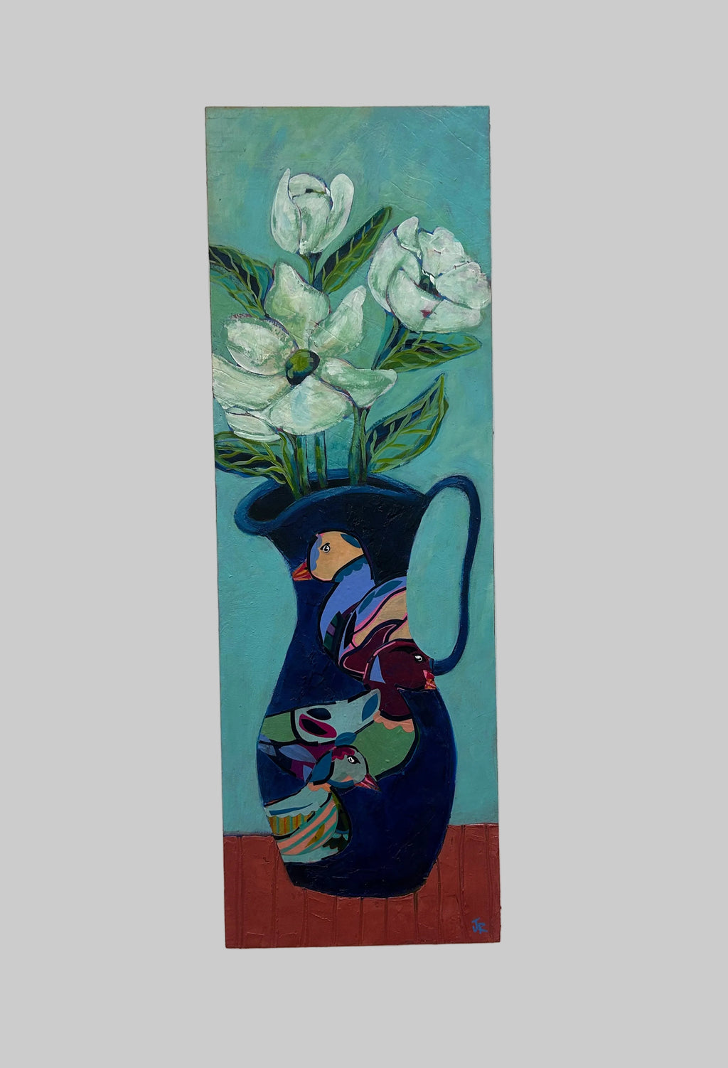 Abstract painting of a face and flowers on a white wall