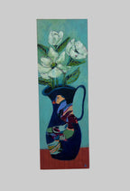 Abstract painting of a face and flowers on a white wall