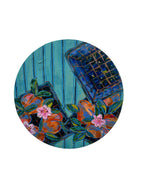 Decorative plate with floral design on a white wall