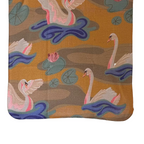 Textile with a pattern of swans and lily pads on a brown background