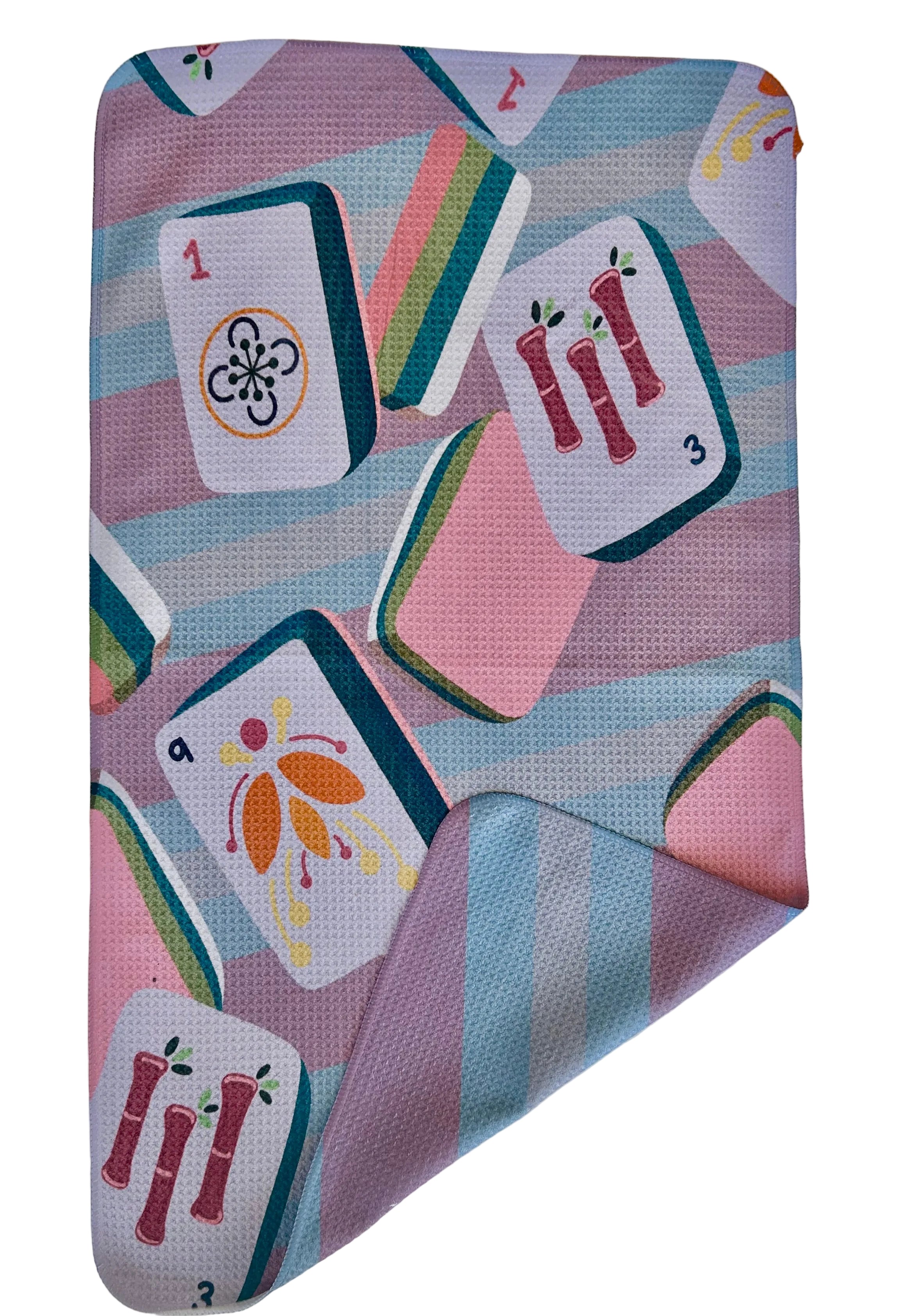Colorful fabric with card game symbols on a white background