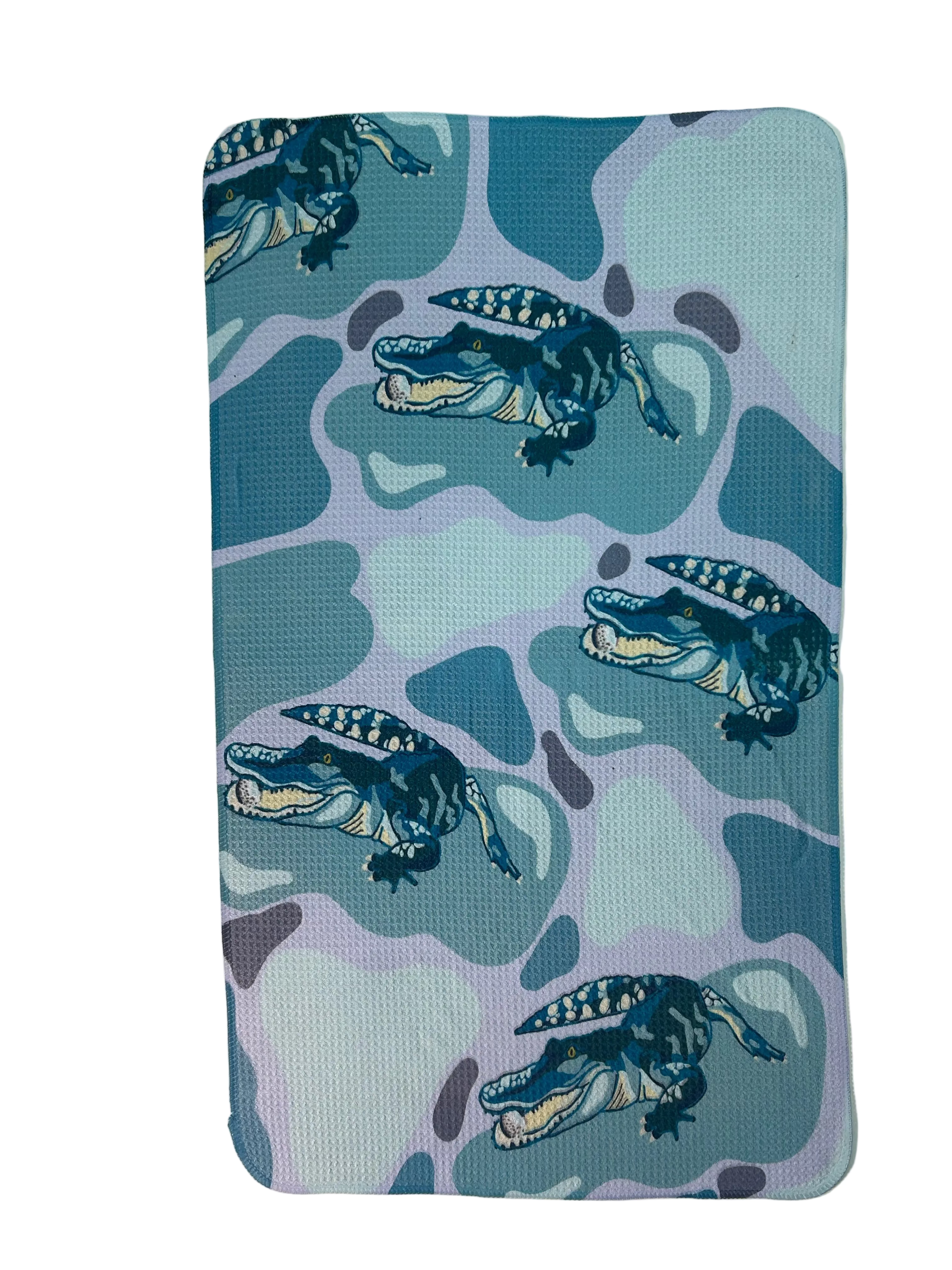 Towel with alligator pattern on a light blue and violet background