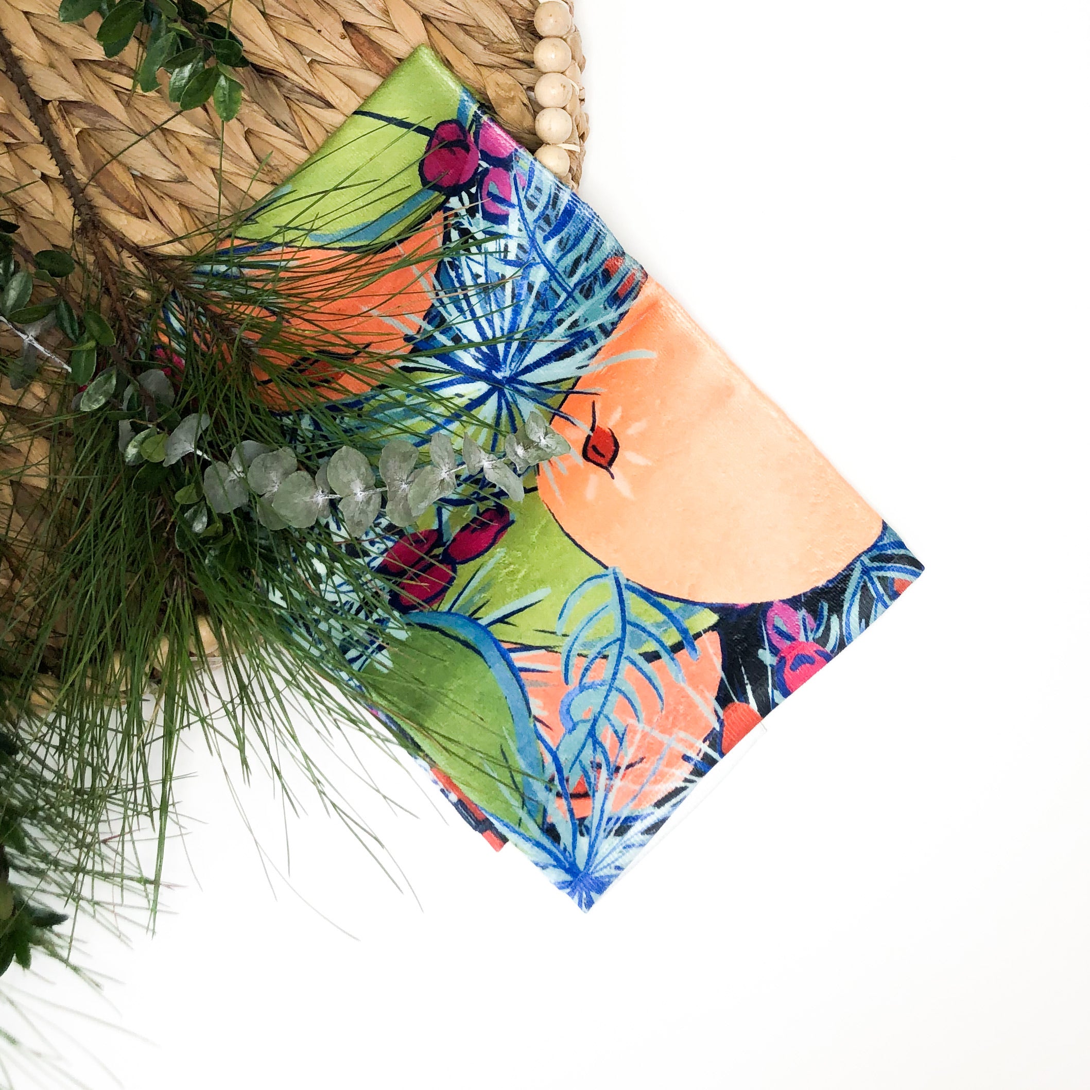 Tea towel hand designed by Jessica Reynolds with citrus and greenery design on a microfiber towel with terry loop backing..