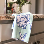 Blue magnolia bunny  tea towel hand designed by Jessica Reynolds.  Microfiber front with a terry loop backing.