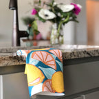 Tea towel hand designed by Jessica Reynolds with a lemon themed design on a waffle microfiber towel.